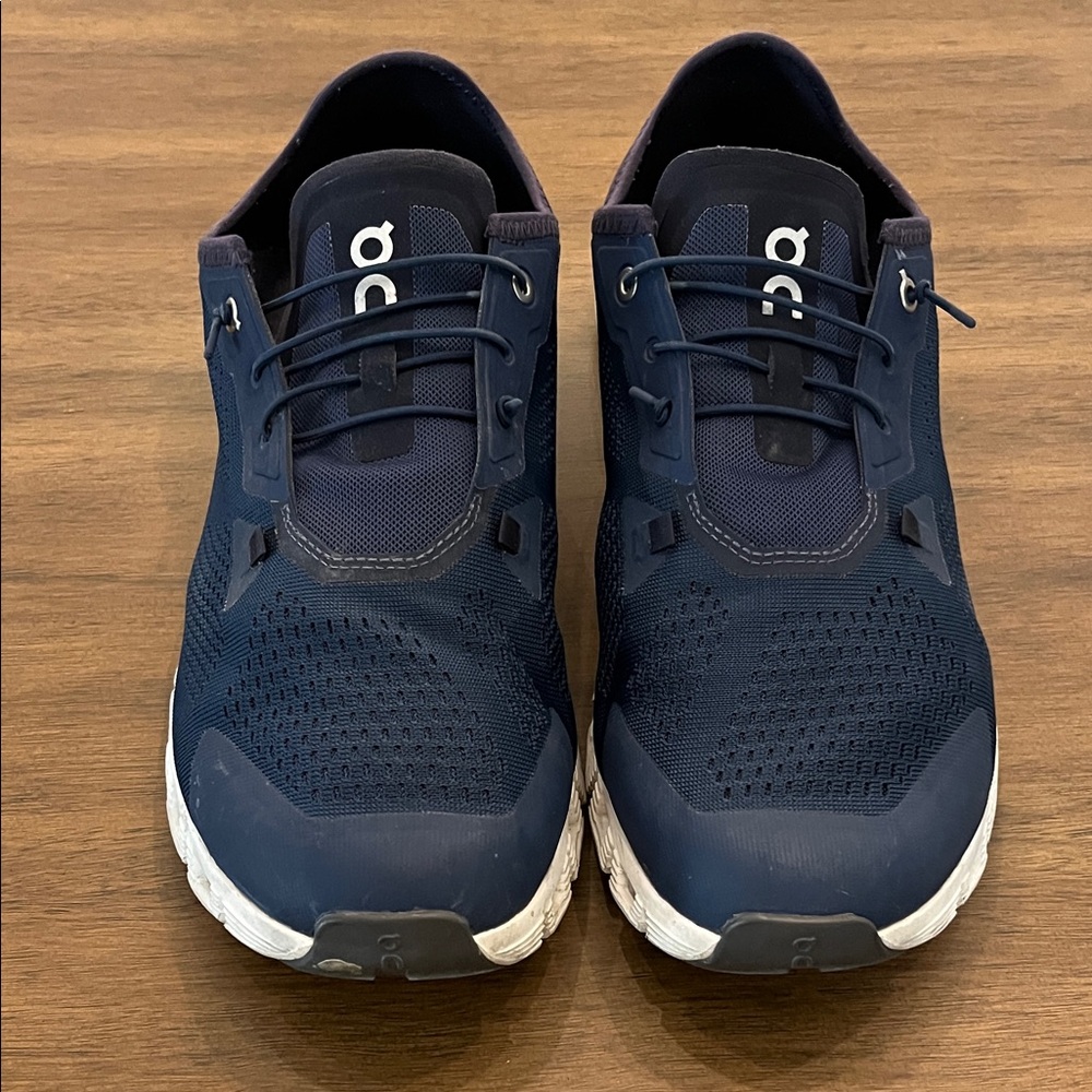 On cloudRunning Men's Dark Blue Sneakers with flip down rear.